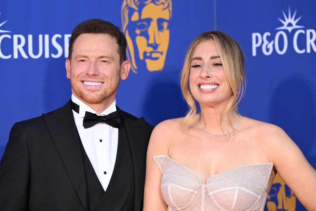 Joe Swash in suit and Stacey Solomon in strapless dress