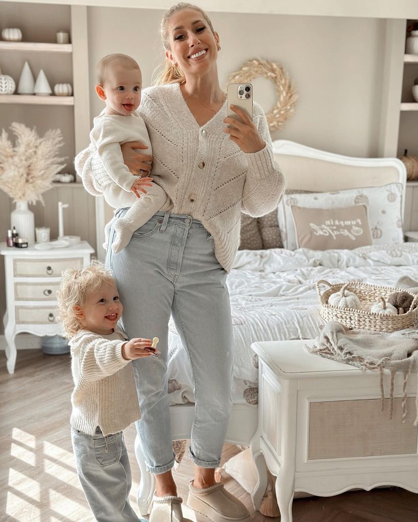 stacey and two kids in neutral bedroom selfie