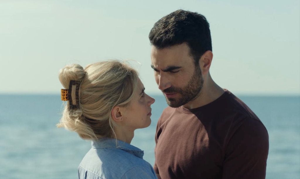 Two people standing close to each other
