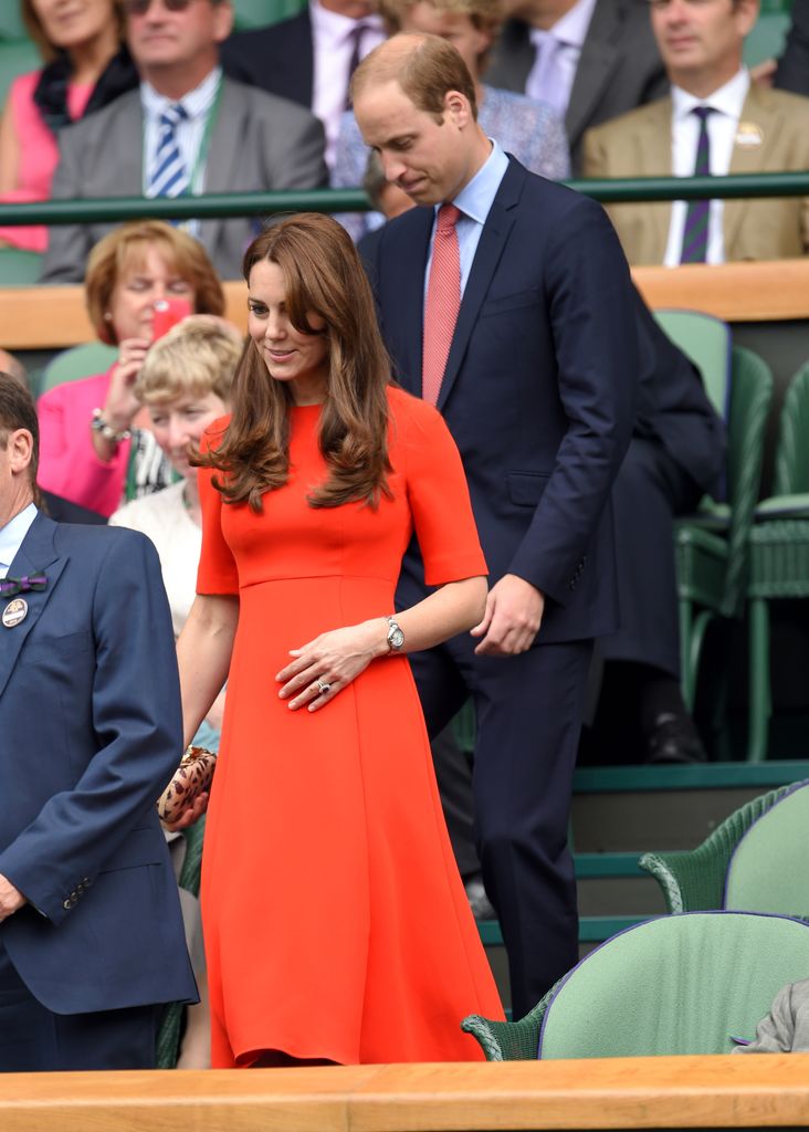 Kate in an orange dress entering royal box at Wimbledon