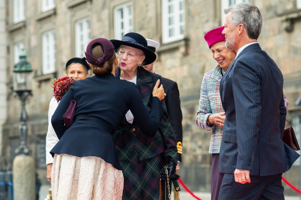 Queen Margrethe kissing Queen Mary