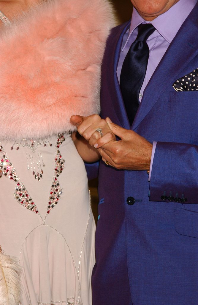 Rod Stewart And Penny Lancaster's hands up close showing ring