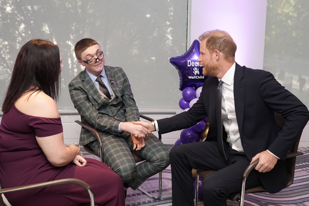 Prince Harry, Duke of Sussex shakes hands with Declan recipient of the Inspirational Young Person 15-18 award, at the annual WellChild Awards 2025