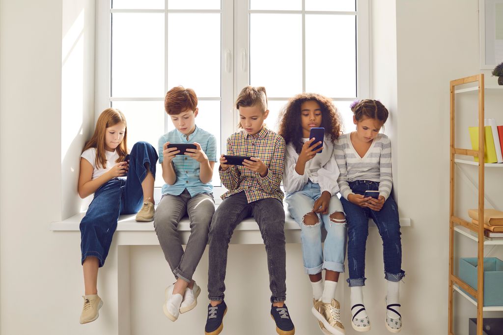 children on mobile phones and tablets.