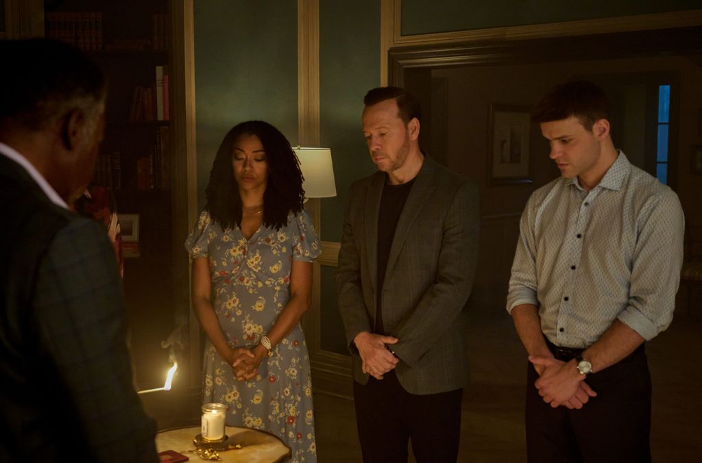 Ernie Hudson as Reverend Peters, Sonequa Martin-Green as Lena Silver, Donnie Wahlberg as Danny Reagan, and Mika Amonsen as Sean Reagan on Boston Blue