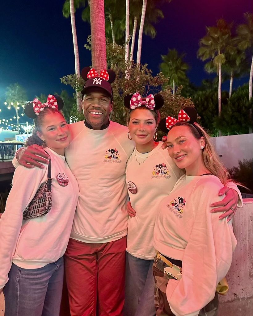 Michael Strahan visits Disney Land with his girlfriend Kayla Quick and his twin daughters Isabella and Sophia on their birthday, shared on Instagram