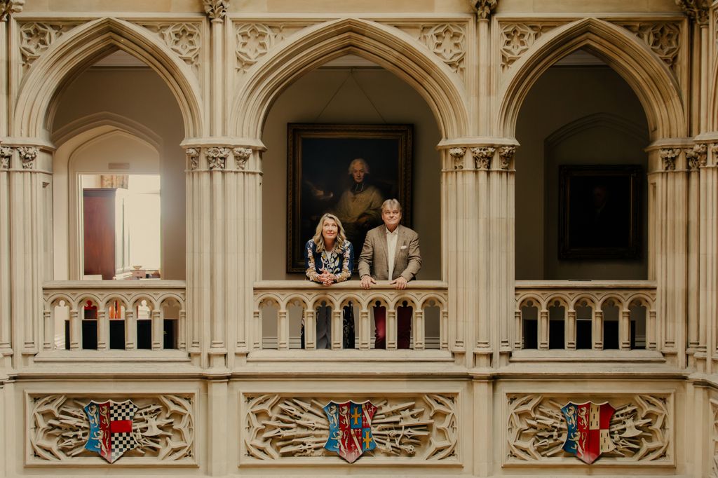 Lord and Lady Carnarvon on the balcony overlooking the saloon at Highclere Castle, Highclere, Newbury, Hampshire, United Kingdom. 29th August 2025