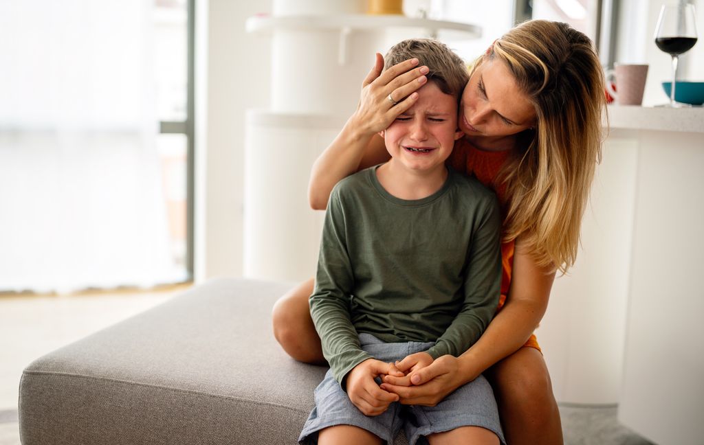 mother comforting strong willed child