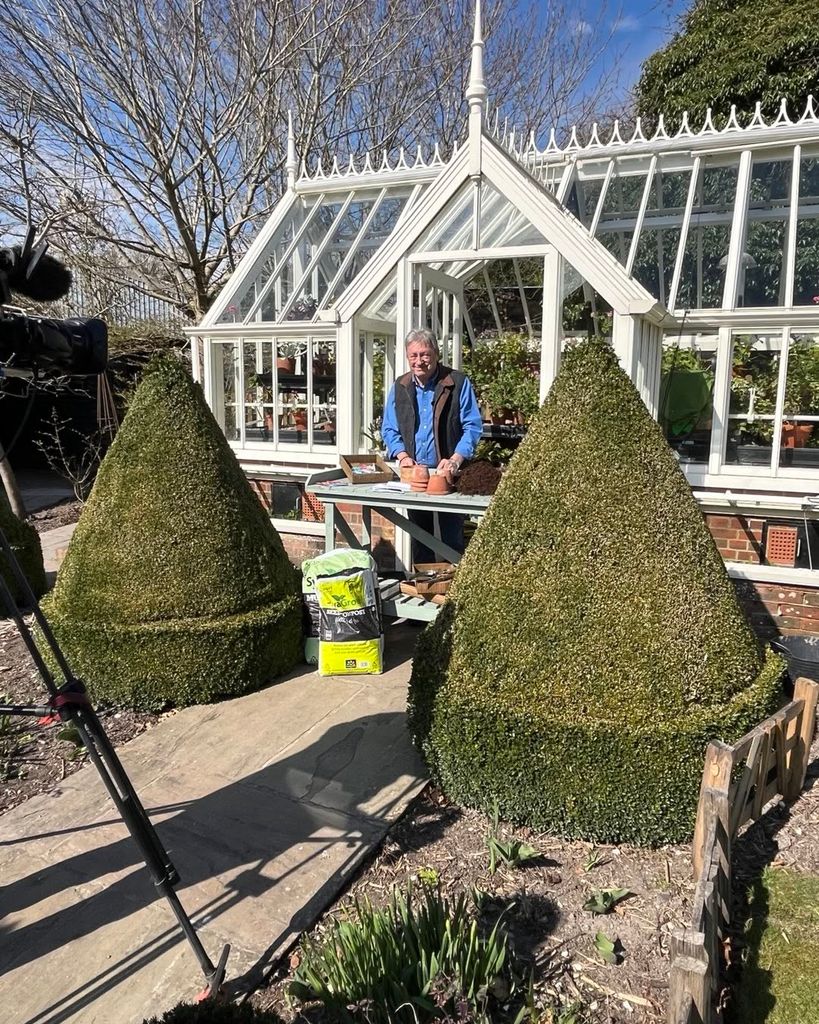 Alan Titchmarsh filming while standing outside his conservatory at home