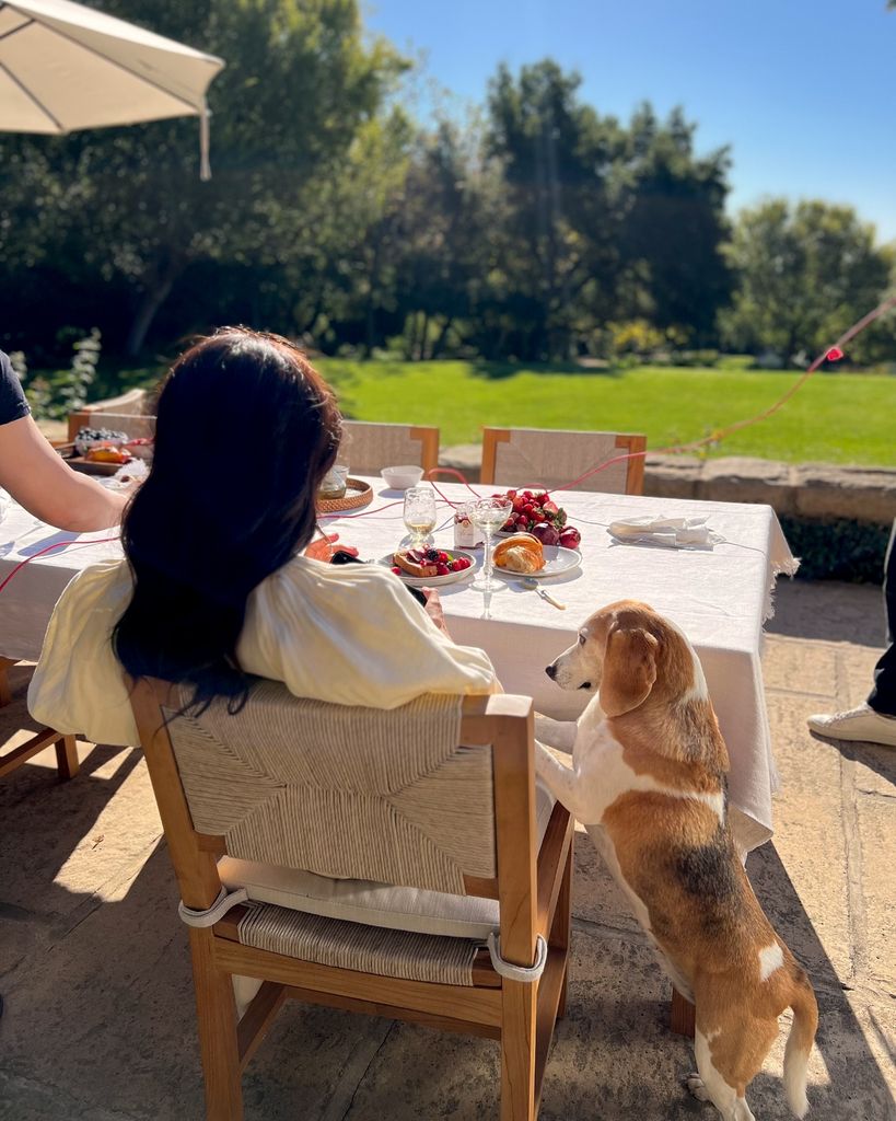 Meghan Markle sitting at her garden chairs in her Montecito mansion