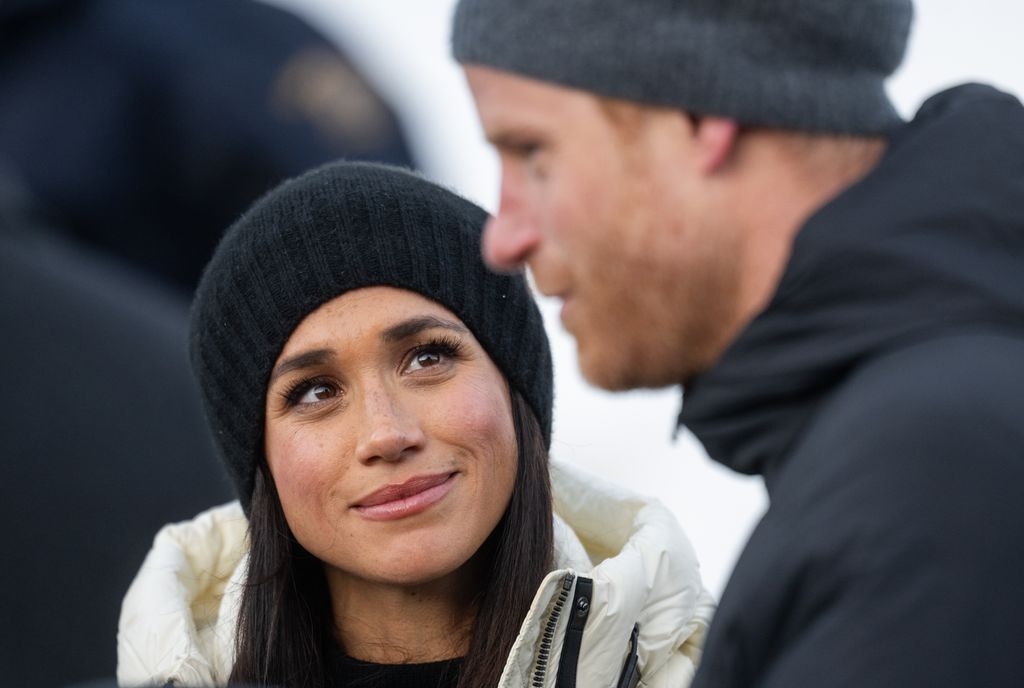 Meghan shares a loving look at Harry