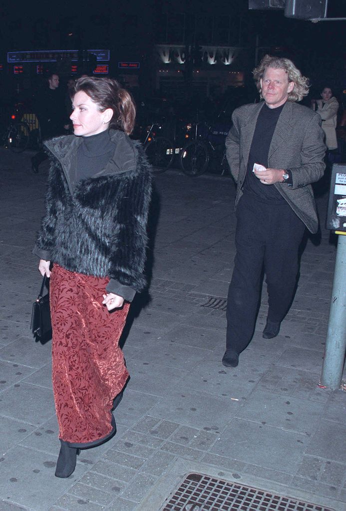 Shania Twain and Mutt Lange walking separately from each other