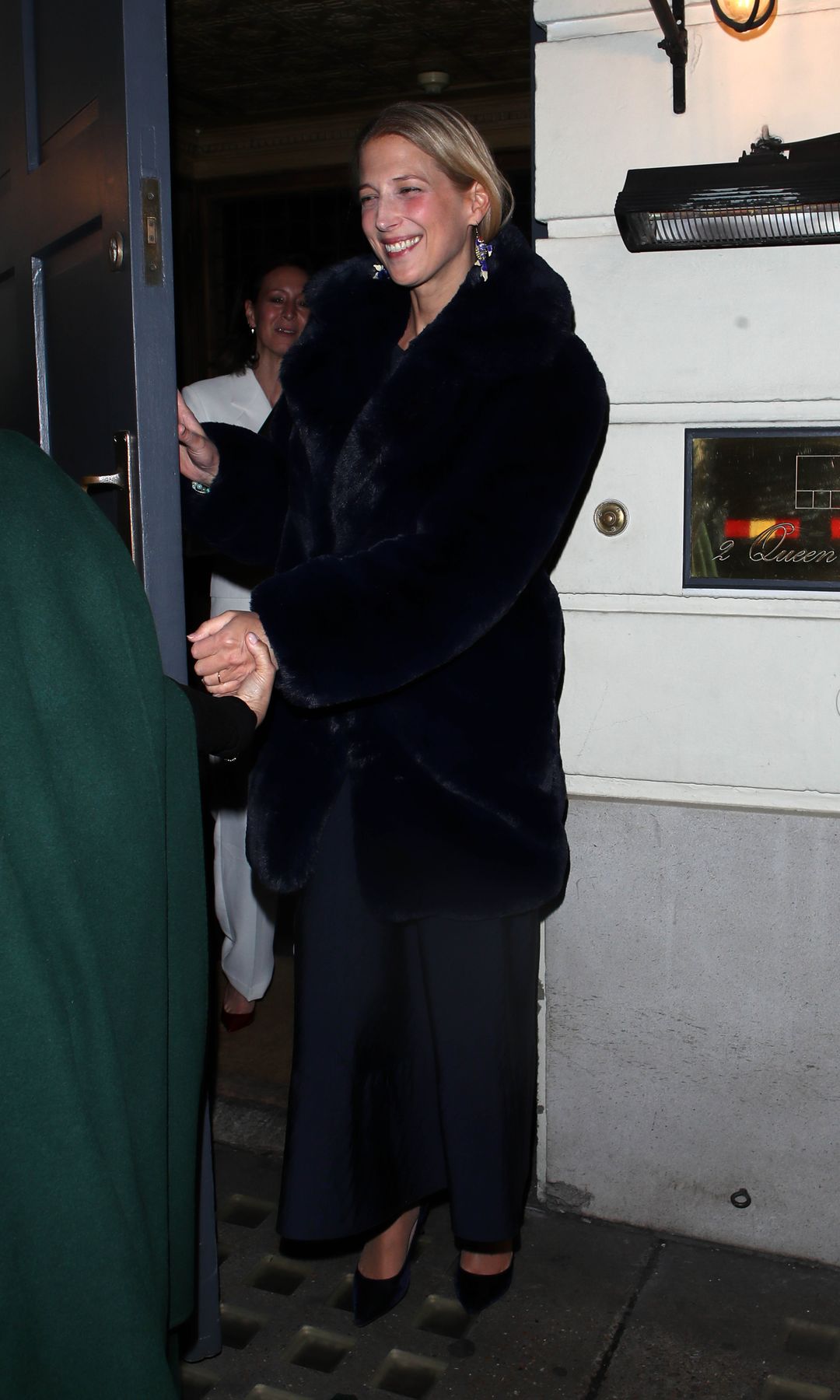 Lady Gabriella Windsor leaving a building with a group of friends