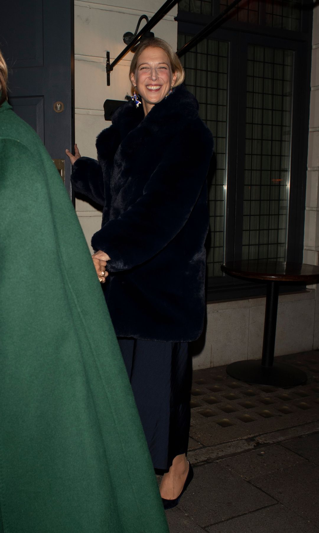 Lady Gabriella Windsor smiling as she leaves a building