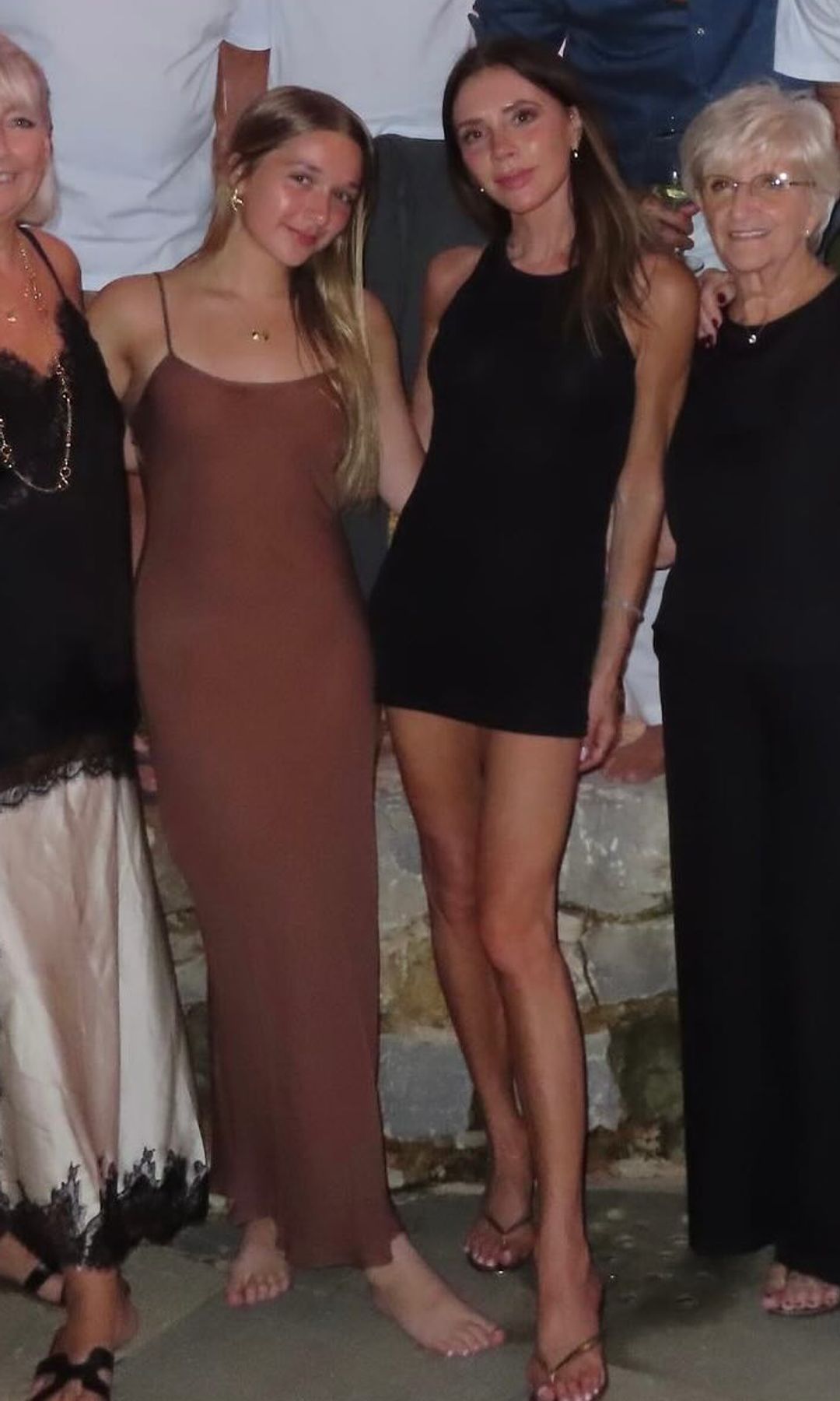 Victoria and Harper Beckham pose for a picture while on holiday 