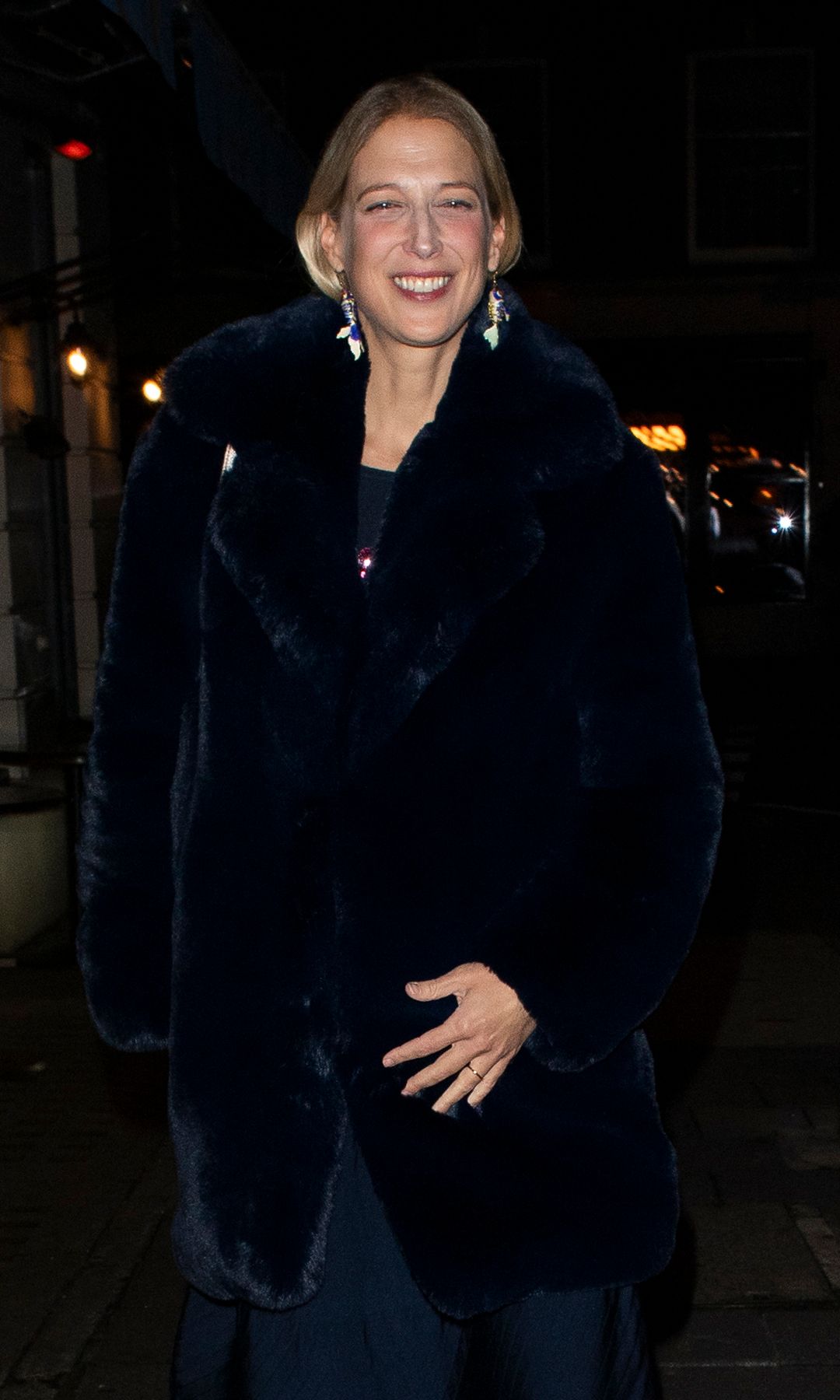 Lady Gabriella Windsor smiling in a satin coat