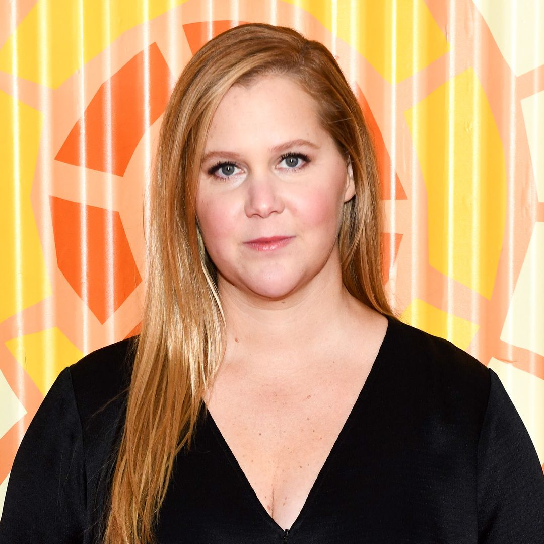 Amy Schumer showcases 40-lb weight loss in tight fitted red dress