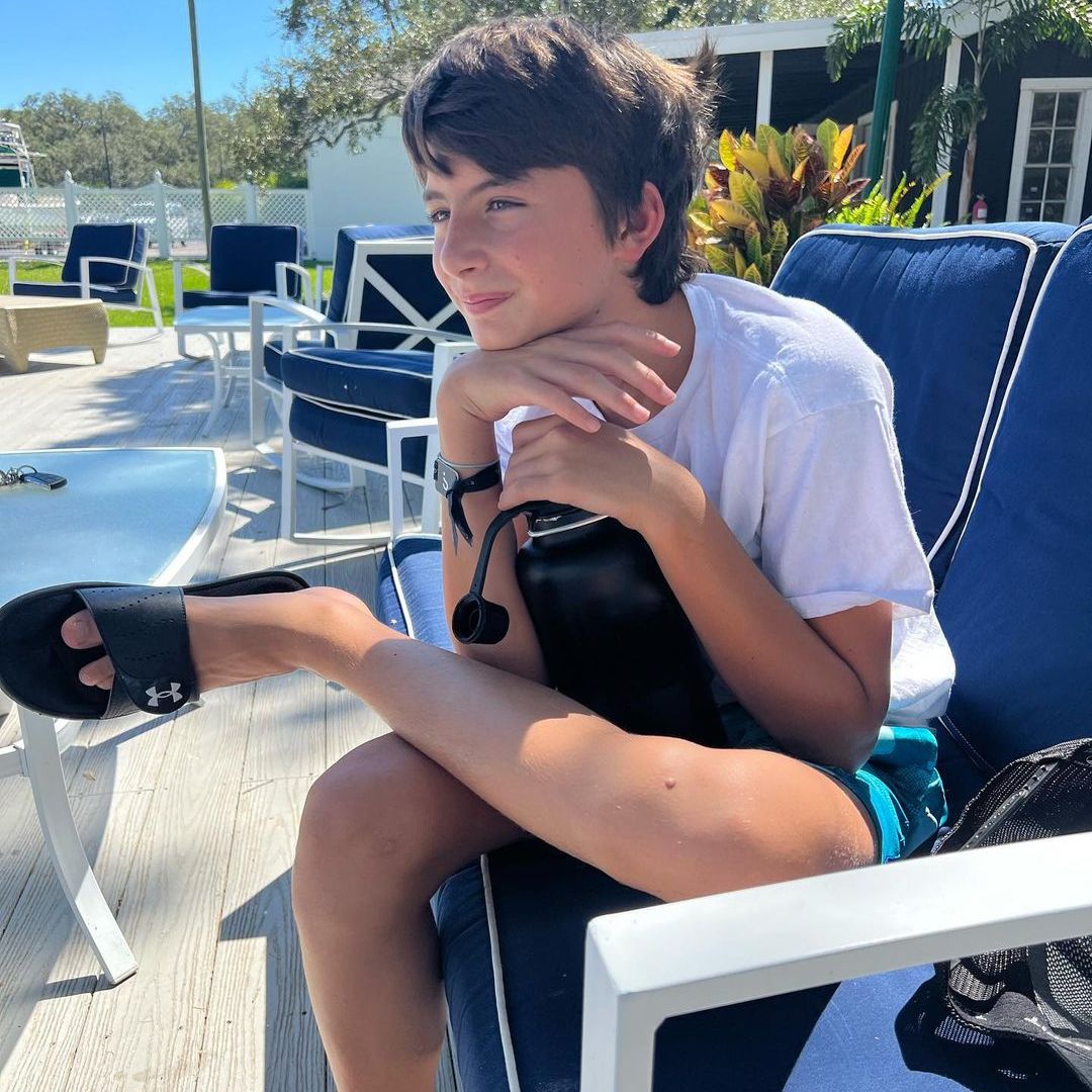 Tom's son Benjamín sat outdoors