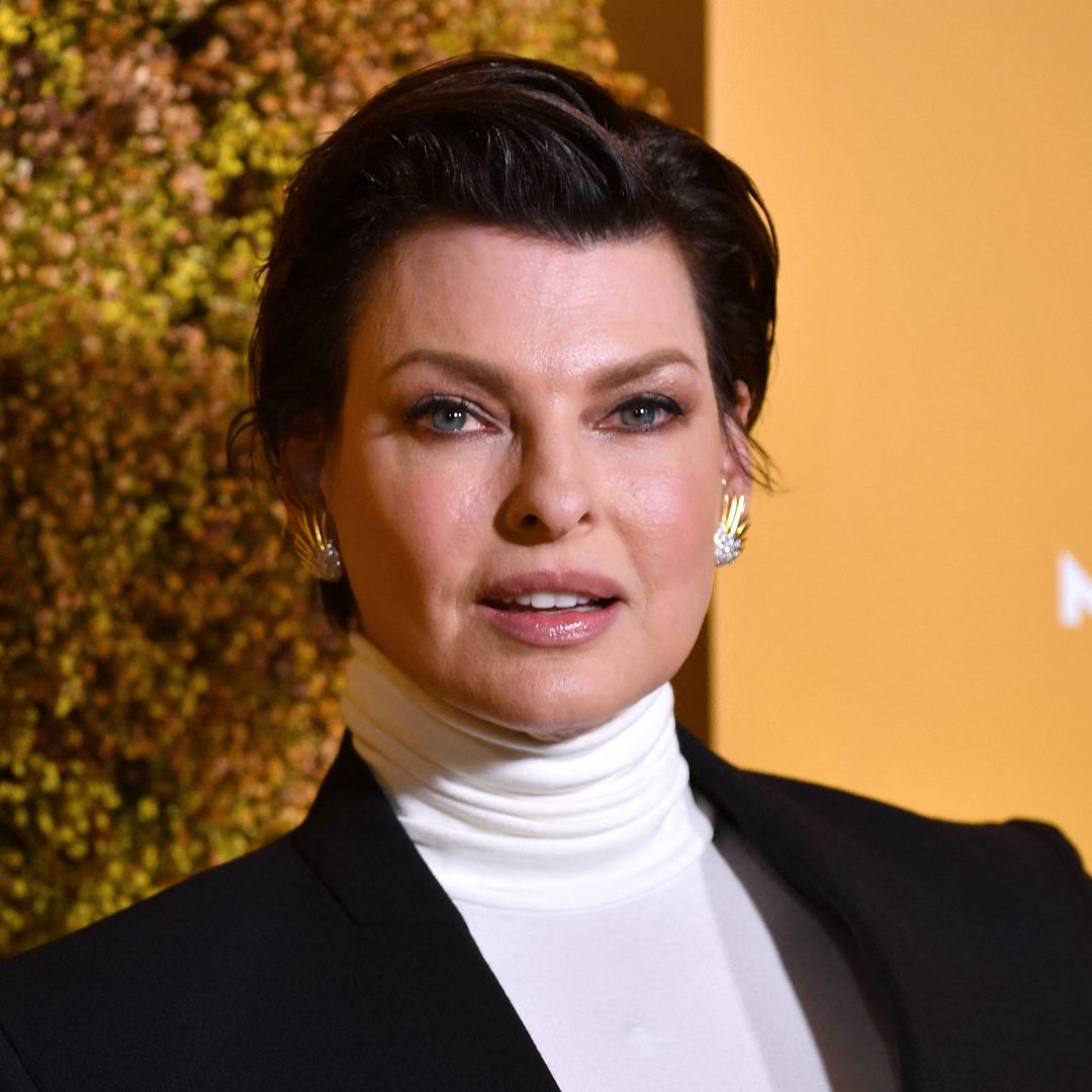 Linda Evangelista holds on to teen son for incredibly rare red carpet appearance