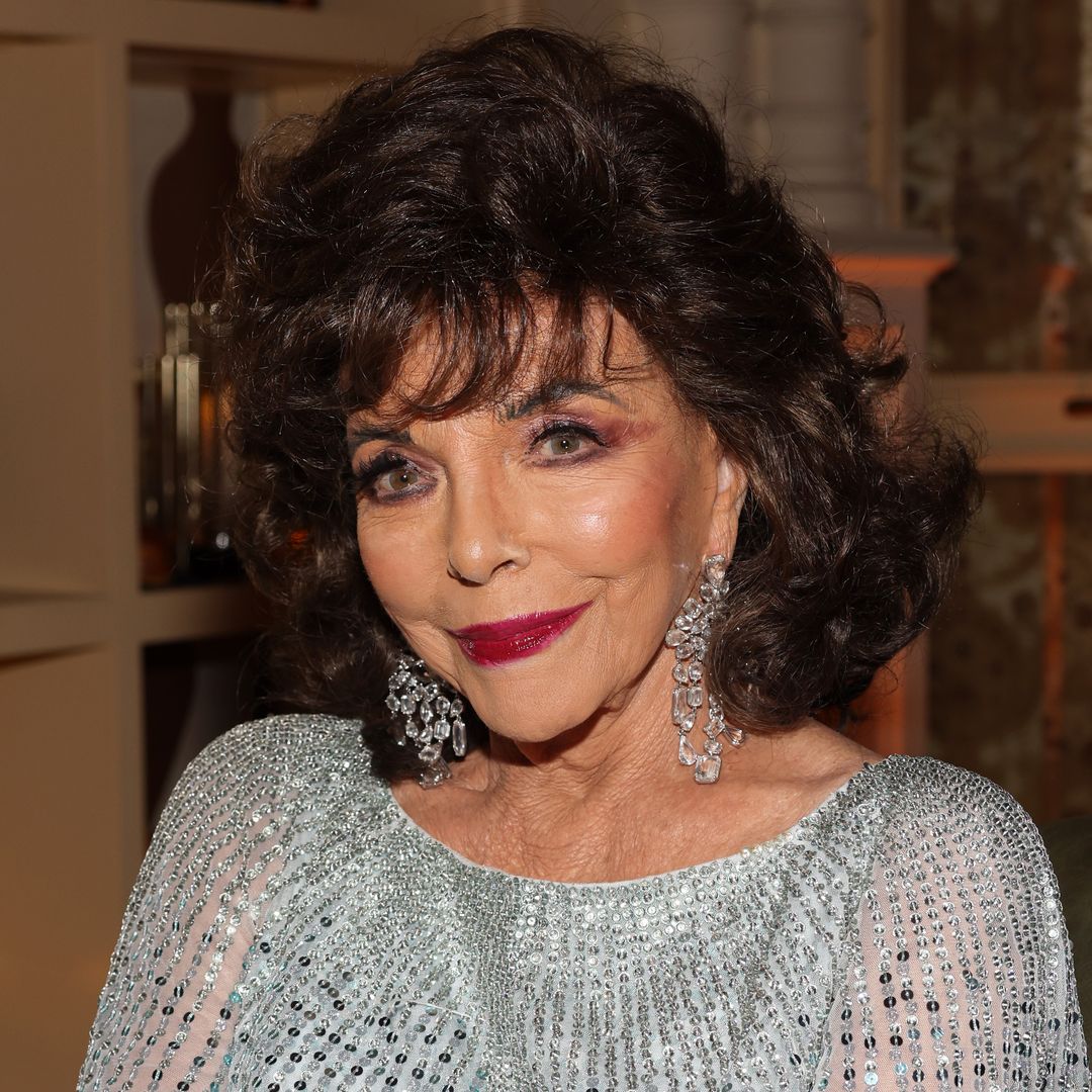 Joan Collins is the ultimate vixen in daring thigh-high split dress