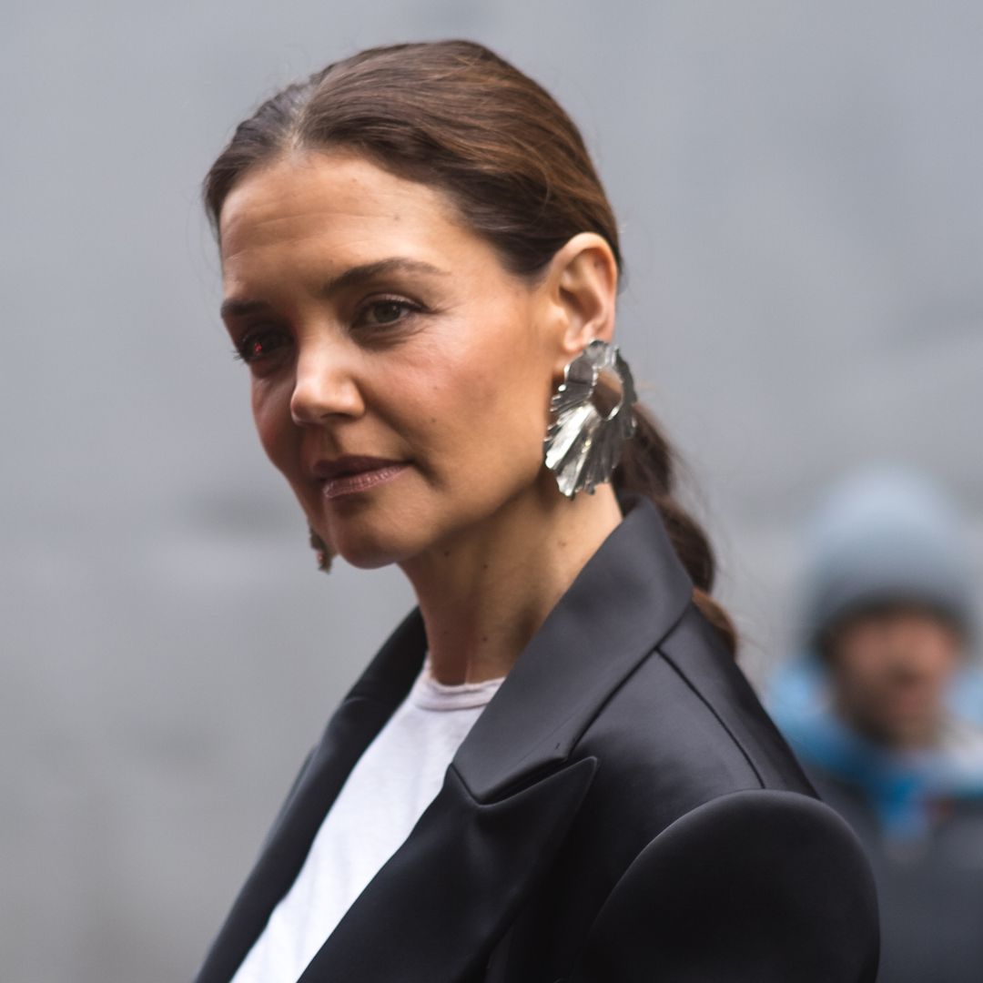 Katie Holmes' silky midi skirt and knee high boots combo is bang on trend for 2025