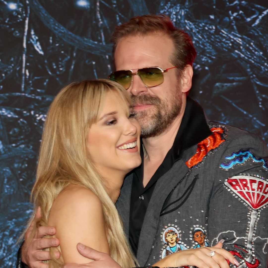 Millie Bobby Brown dazzles in lace gown as she and David Harbour reunite on Stranger Things red carpet