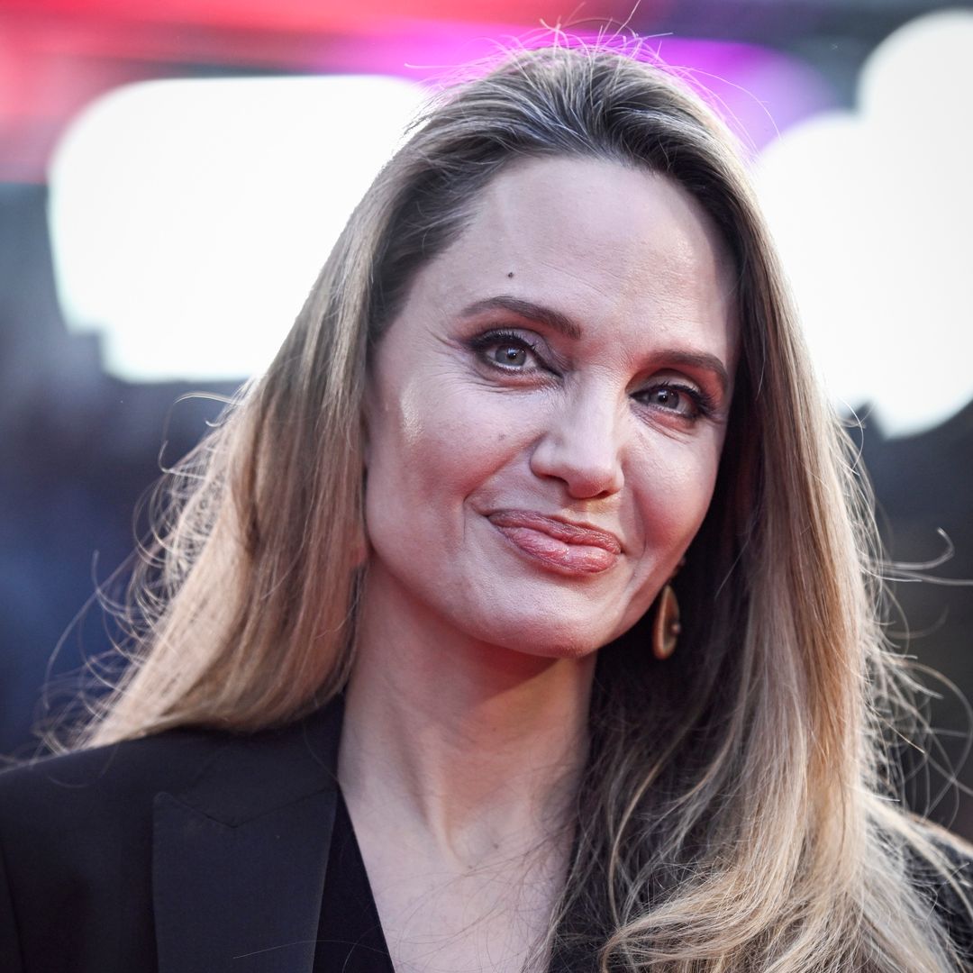 Angelina Jolie looks incredibly youthful in plunging gown on red carpet