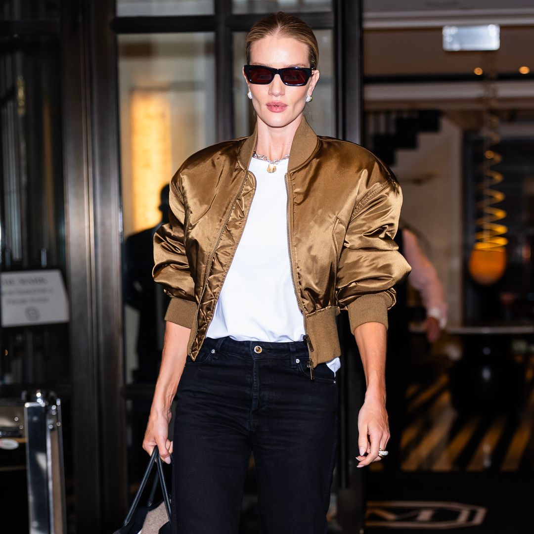 Rosie Huntington-Whiteley goes for gold in metallic bomber and low-rise jeans