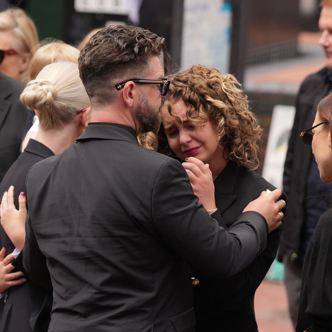 Jack Osbourne comforts his daughter as he arrives with his 4 children at Ozzy Osbourne's procession