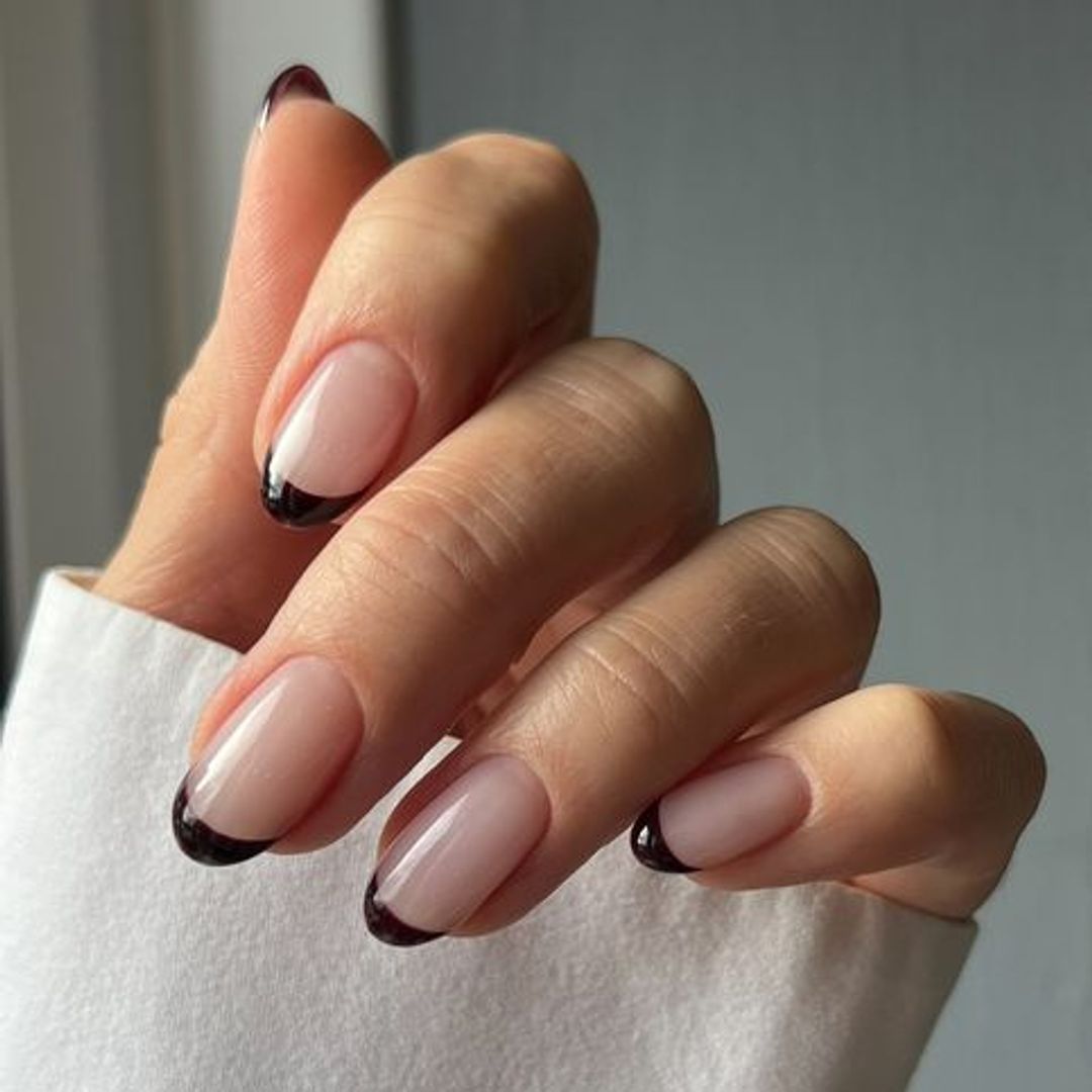 brown and white french manicure nails in earthy tones.