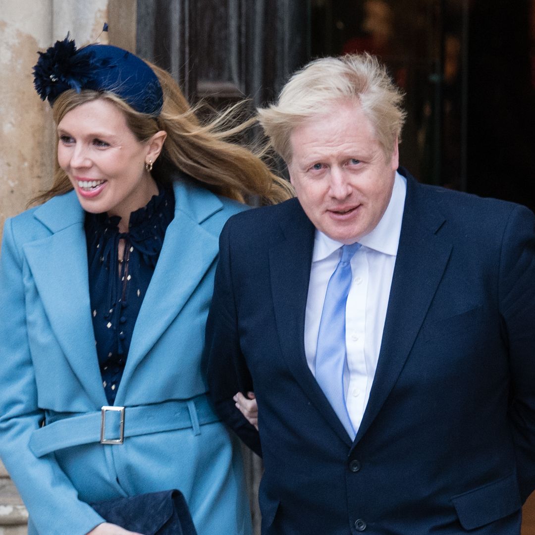 Boris and Carrie Johnson 'photobombed' by wild-haired son Wilfred