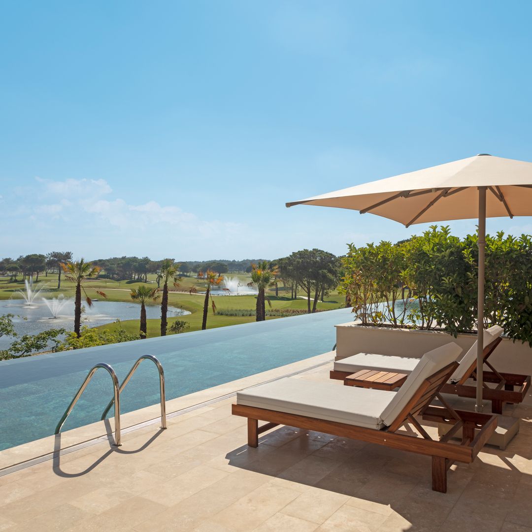 private villa terrace overlooking pool and golf course in turkey