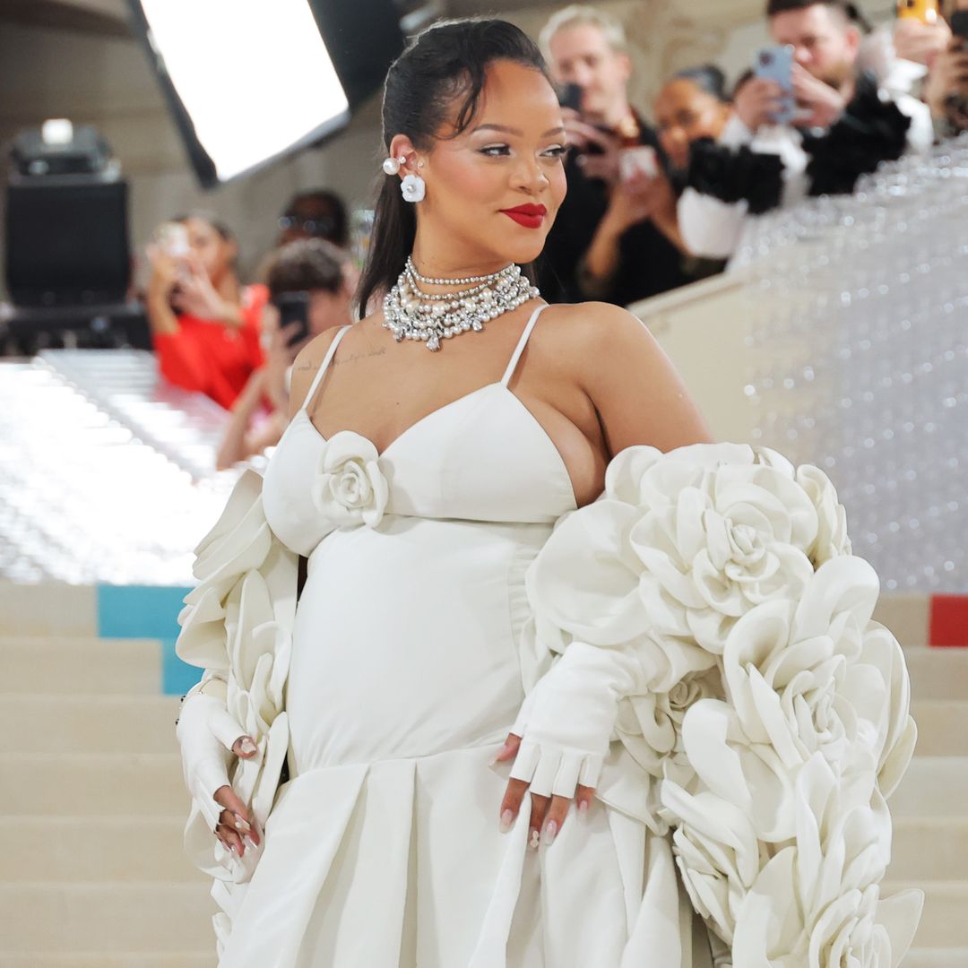 Rihanna reinvents maternity style in striped pants and kitsch graphic top