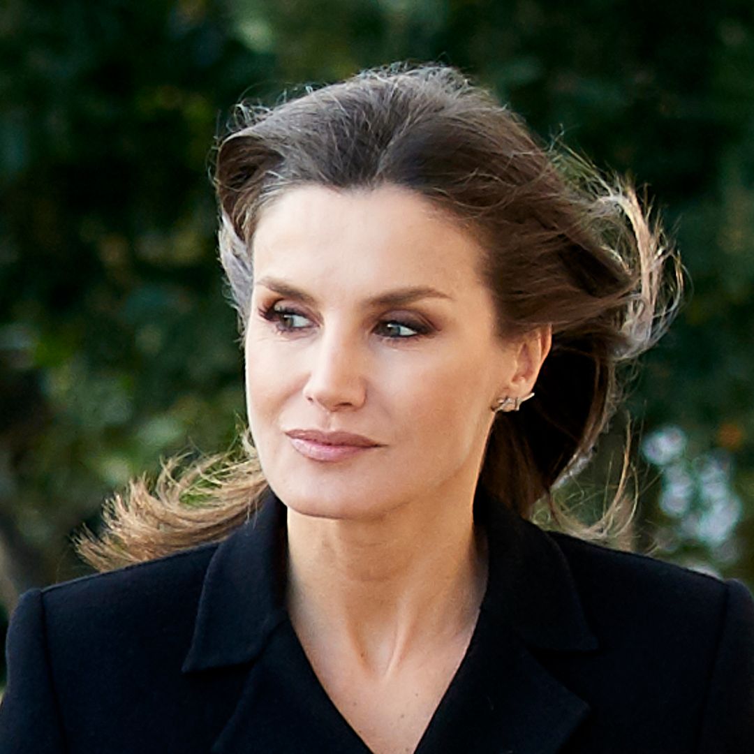 Queen Letizia models lace veil and shin-skimming dress in poignant tribute