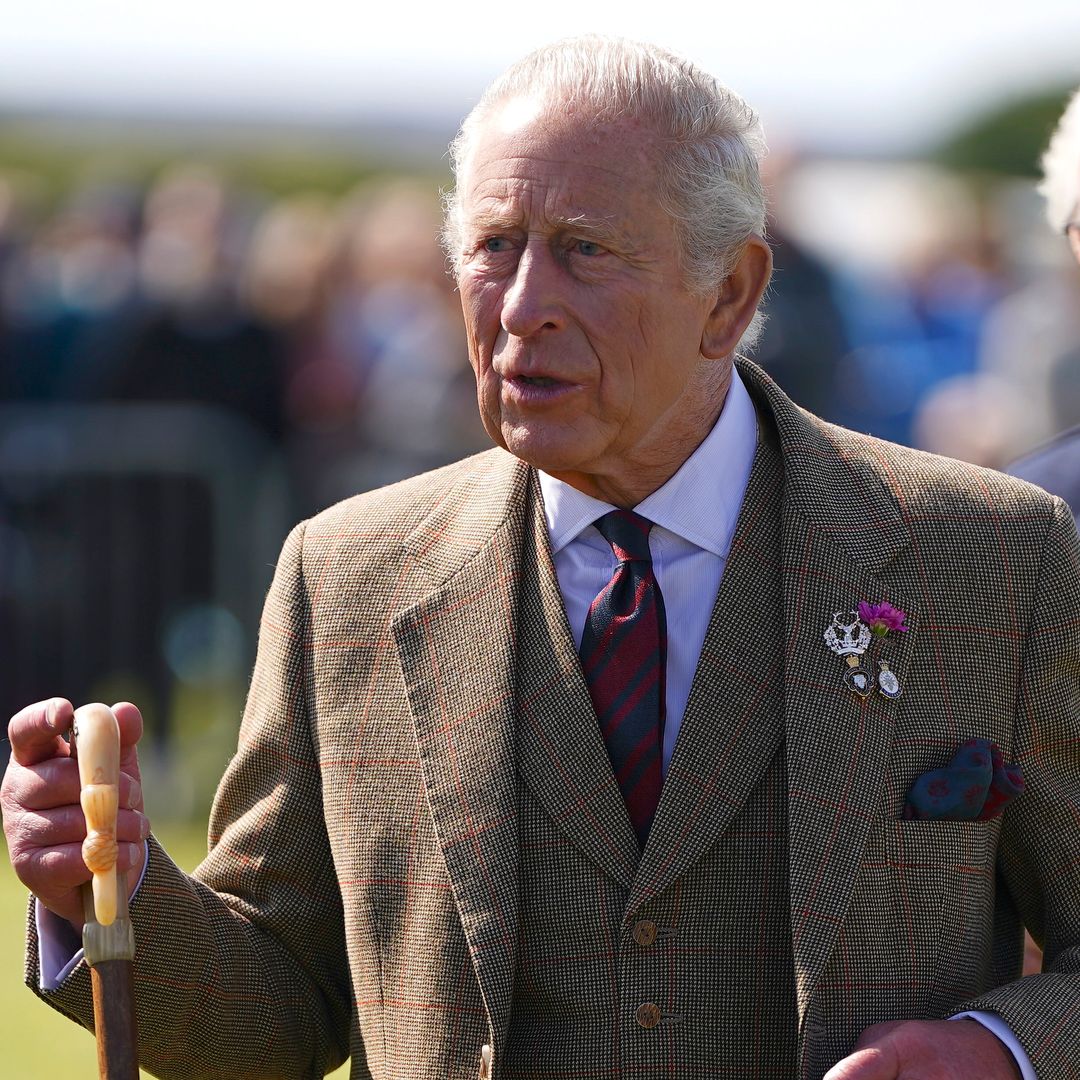 King Charles seen using walking stick as he kicks summer break off in style