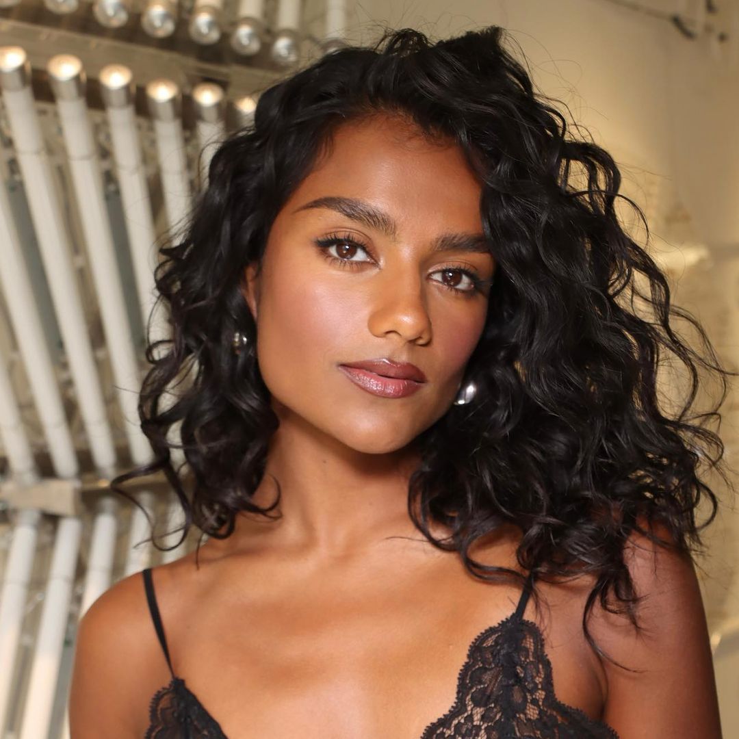 Simone Ashley's leather mini skirt and sheer tights date night look is a major 2025 trend